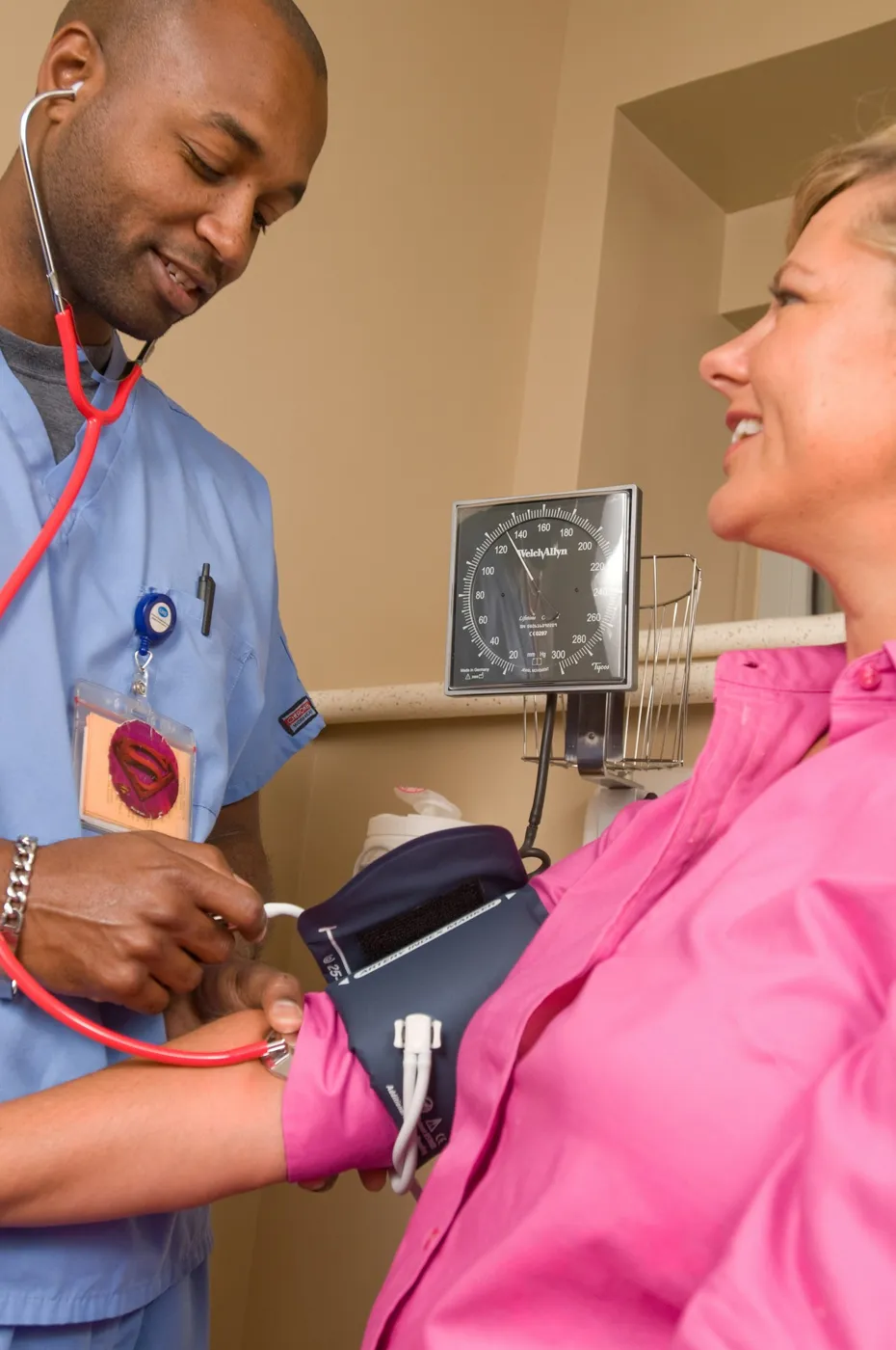Nurse checking a patient's blood pressure