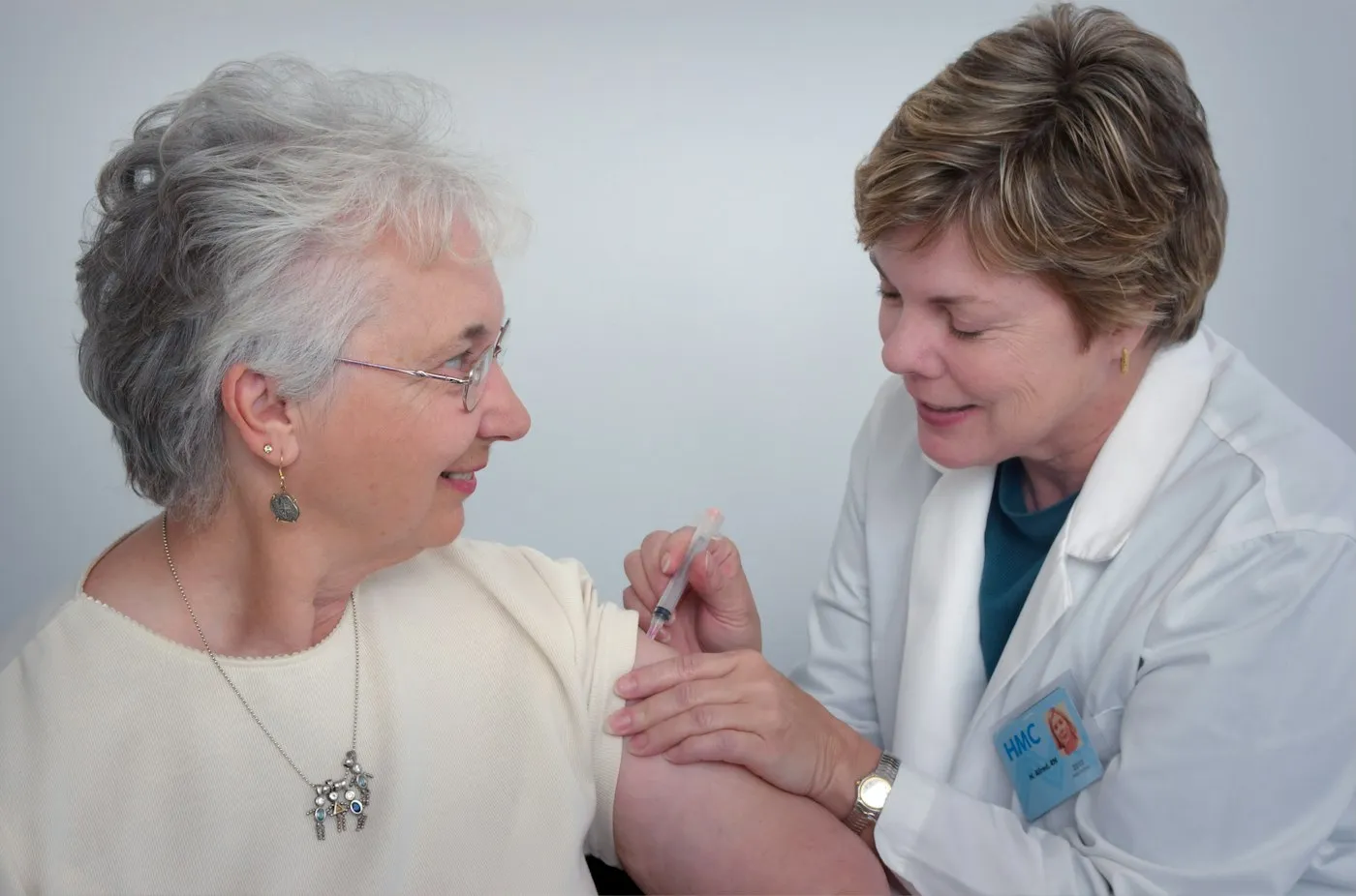 Senior woman receiving care from a nurse